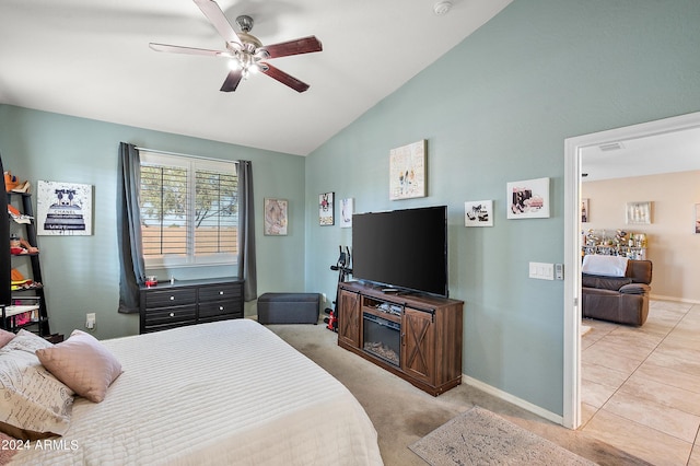 bedroom featuring baseboards, ceiling fan, and lofted ceiling