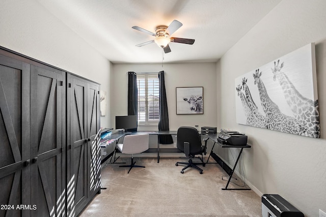 office area with light carpet and ceiling fan