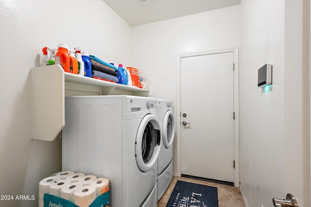 laundry room featuring washer and clothes dryer and laundry area
