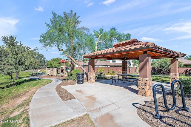 view of home's community with a gazebo and playground community
