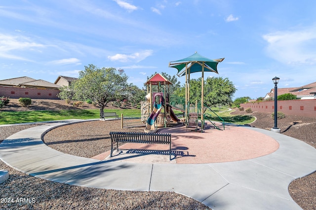 communal playground with a lawn