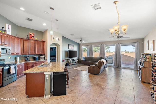 kitchen with a sink, light tile patterned floors, visible vents, and appliances with stainless steel finishes