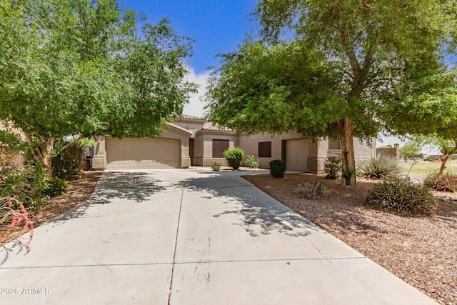 41804 W Carlisle Ln, Maricopa, AZ 85138 - view of front facade with concrete driveway, a garage, stucco siding, and a tile roof