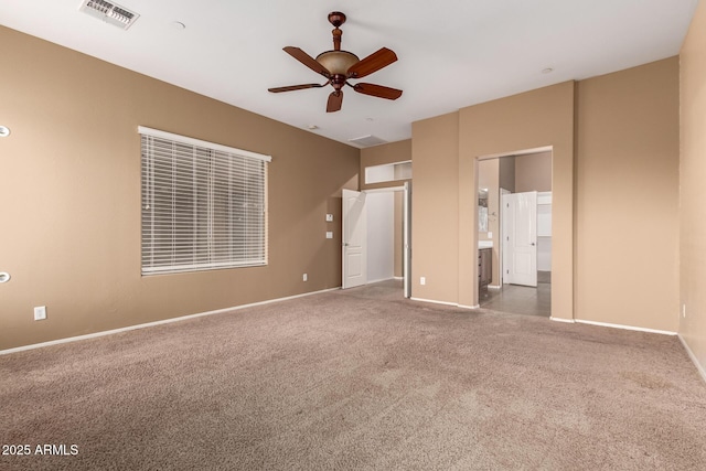 41804 W Carlisle Ln, Maricopa, AZ 85138 - unfurnished bedroom with carpet floors, baseboards, and connected bathroom