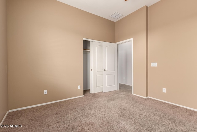 41804 W Carlisle Ln, Maricopa, AZ 85138 - unfurnished bedroom with carpet flooring, a closet, and baseboards