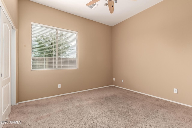 41804 W Carlisle Ln, Maricopa, AZ 85138 - empty room featuring a ceiling fan, carpet, and baseboards