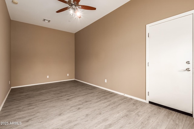 41804 W Carlisle Ln, Maricopa, AZ 85138 - unfurnished room with ceiling fan, lofted ceiling, wood finished floors, and baseboards
