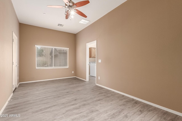 41804 W Carlisle Ln, Maricopa, AZ 85138 - unfurnished room with ceiling fan, washer / clothes dryer, and light wood finished floors
