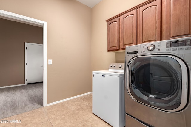 41804 W Carlisle Ln, Maricopa, AZ 85138 - laundry area with washing machine and dryer, cabinet space, baseboards, and light tile patterned flooring