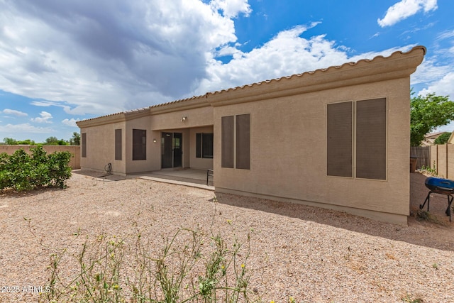 41804 W Carlisle Ln, Maricopa, AZ 85138 - rear view of property with fence, a patio area, and stucco siding
