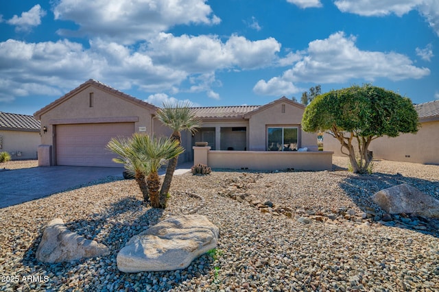 view of front of property with a garage