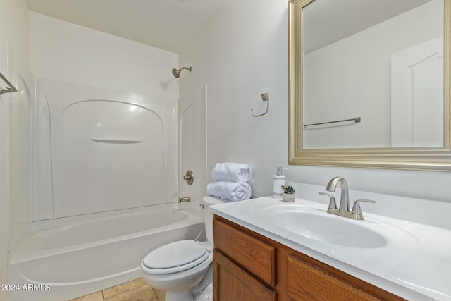 full bathroom featuring tile patterned flooring, vanity, toilet, and  shower combination