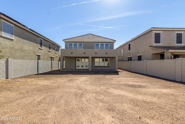 back of house featuring french doors