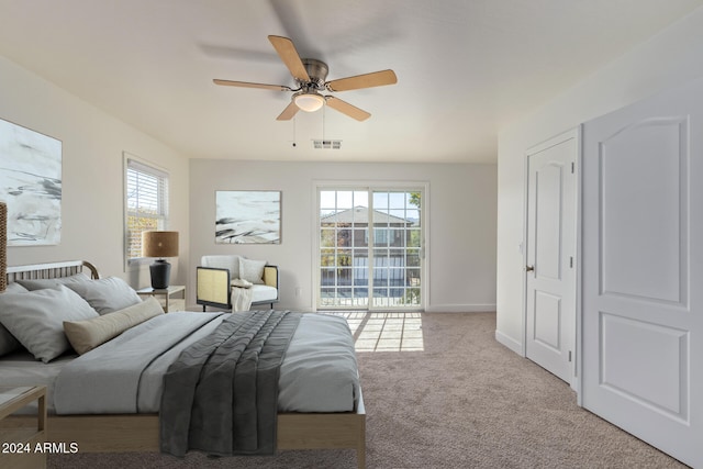 carpeted bedroom featuring ceiling fan