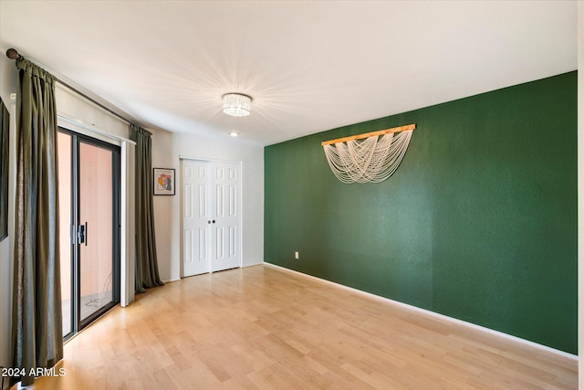 spare room featuring light hardwood / wood-style floors