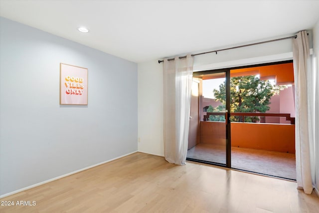 spare room featuring hardwood / wood-style floors