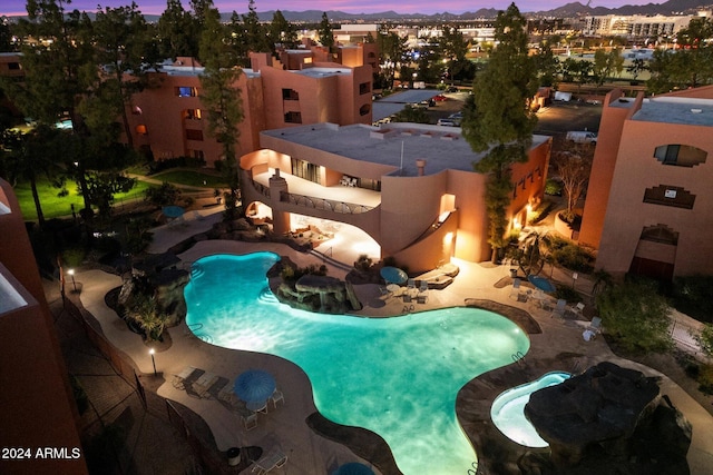 view of pool at dusk