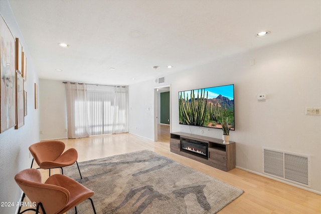 living room with light hardwood / wood-style flooring