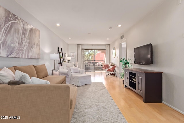 living room with light hardwood / wood-style floors