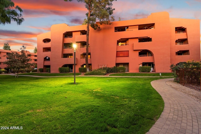 view of outdoor building at dusk