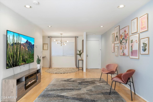 entryway with a notable chandelier and light hardwood / wood-style flooring