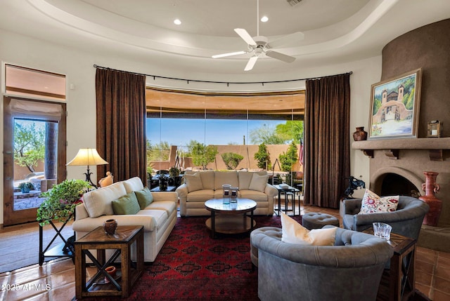 8154 E Tecolote Cir, Scottsdale, AZ 85266 - living room with ceiling fan, recessed lighting, a large fireplace, and a raised ceiling