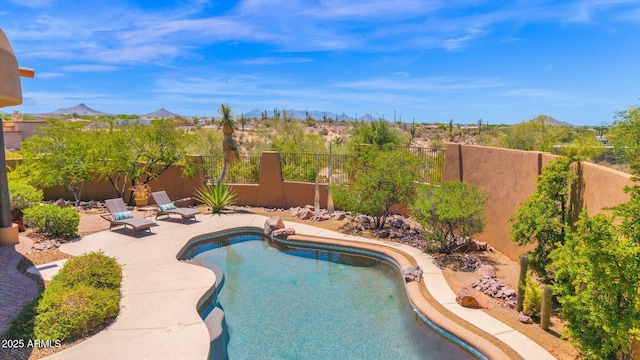8154 E Tecolote Cir, Scottsdale, AZ 85266 - view of pool featuring a mountain view, a fenced backyard, and a patio