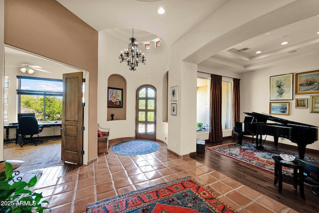 8154 E Tecolote Cir, Scottsdale, AZ 85266 - tiled entrance foyer featuring arched walkways, a chandelier, recessed lighting, and a ceiling fan
