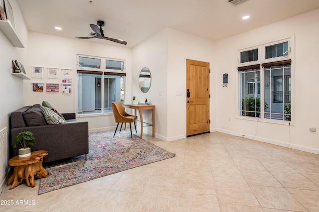 entrance foyer with ceiling fan and light tile patterned floors