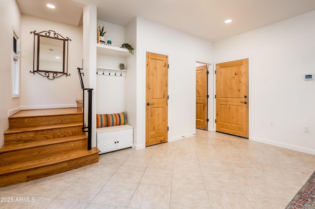 mudroom with light tile patterned flooring