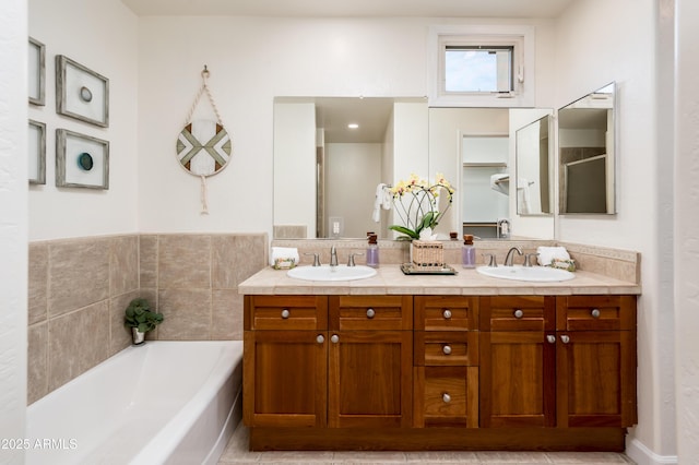 bathroom with vanity and a bathtub