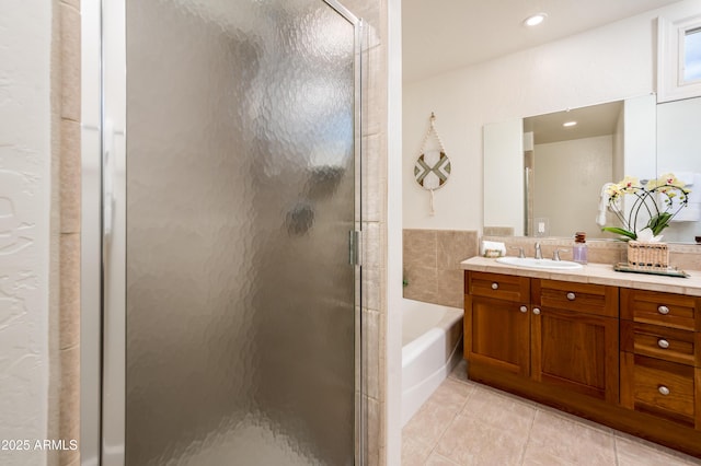 bathroom with vanity, separate shower and tub, and tile patterned floors