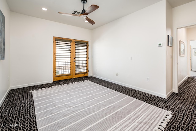 unfurnished bedroom featuring dark carpet and ceiling fan