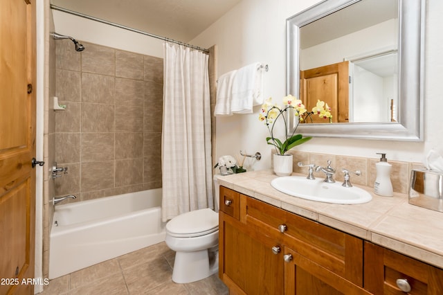 full bathroom featuring shower / tub combo, vanity, tile patterned floors, and toilet