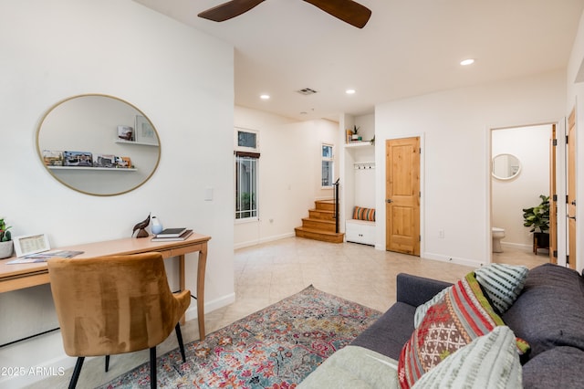 living room featuring light tile patterned floors and ceiling fan