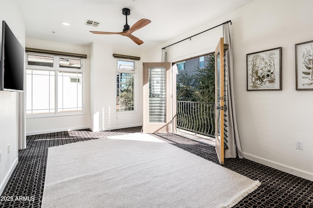 carpeted bedroom featuring ceiling fan and access to exterior