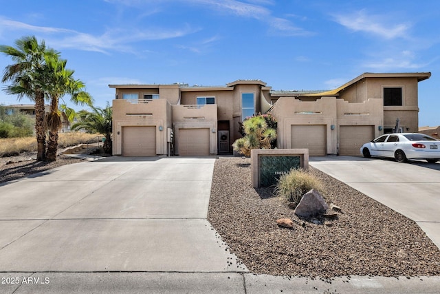 12852 N Mountainside Dr Unit 2, Fountain Hills, AZ 85268 - view of front facade with concrete driveway, stucco siding, and a garage
