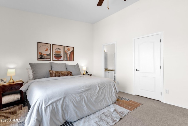 12852 N Mountainside Dr Unit 2, Fountain Hills, AZ 85268 - bedroom with carpet floors, connected bathroom, and ceiling fan