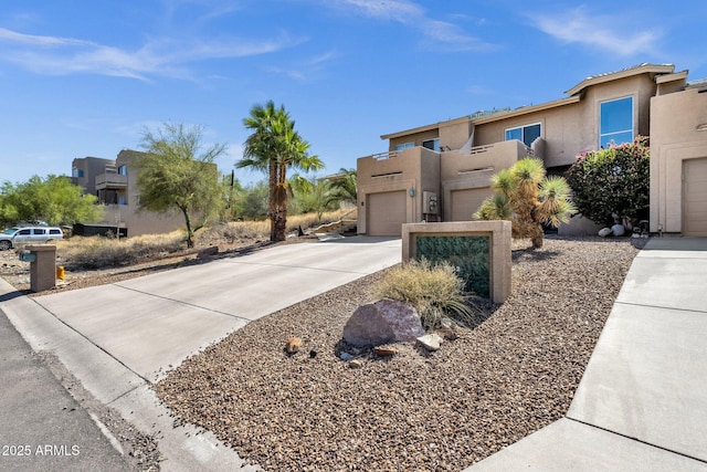 12852 N Mountainside Dr Unit 2, Fountain Hills, AZ 85268 - view of front of home with stucco siding and concrete driveway