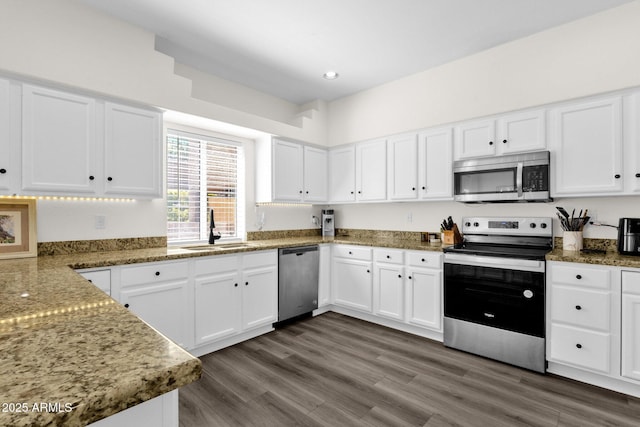 12852 N Mountainside Dr Unit 2, Fountain Hills, AZ 85268 - kitchen with stainless steel appliances, white cabinets, dark wood-style flooring, and recessed lighting