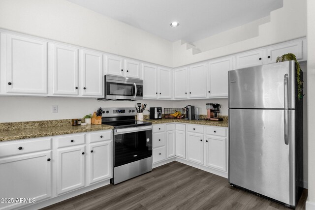 12852 N Mountainside Dr Unit 2, Fountain Hills, AZ 85268 - kitchen with appliances with stainless steel finishes, white cabinets, dark wood-type flooring, light stone counters, and recessed lighting
