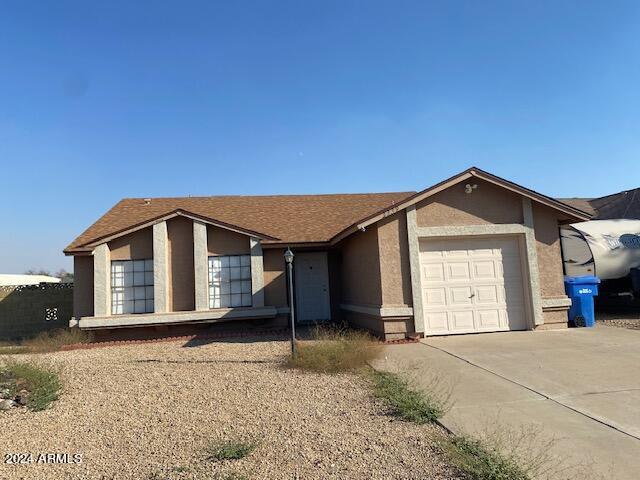 ranch-style home with a garage