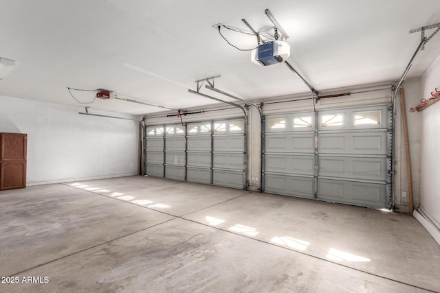 garage featuring a garage door opener