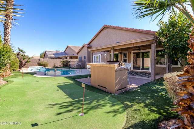 view of yard featuring a patio and ceiling fan