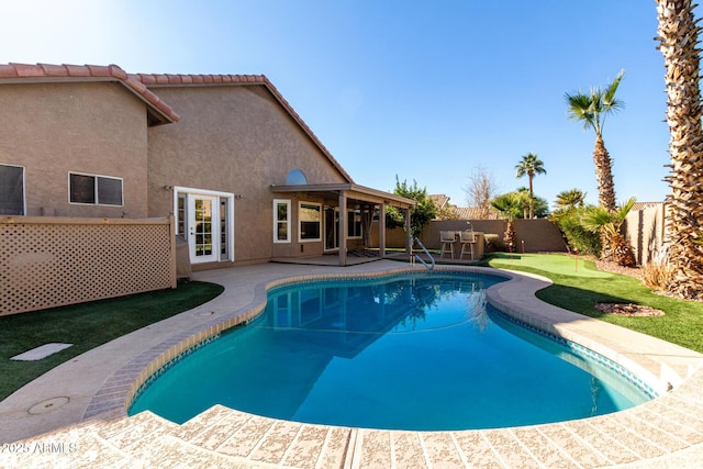 view of swimming pool with a patio