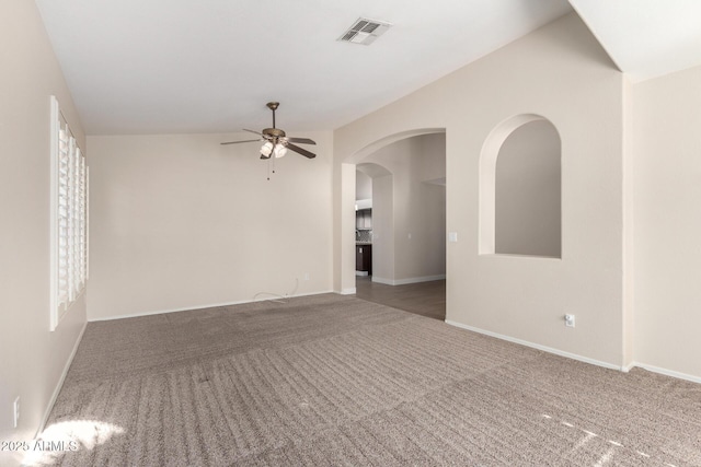 carpeted empty room featuring ceiling fan