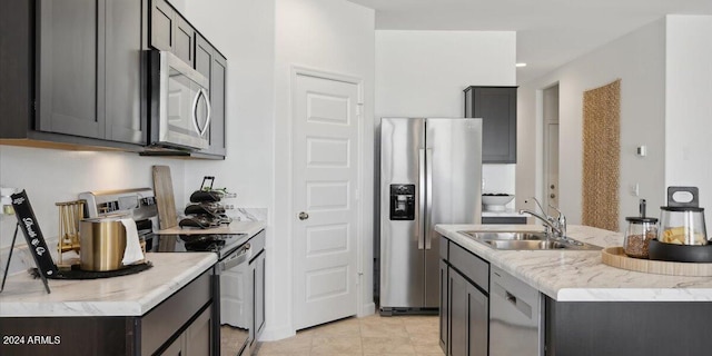 5549 E Mearn Rd, San Tan Valley, AZ 85140 - kitchen featuring stainless steel appliances, a sink, a kitchen island with sink, light tile patterned flooring, and recessed lighting