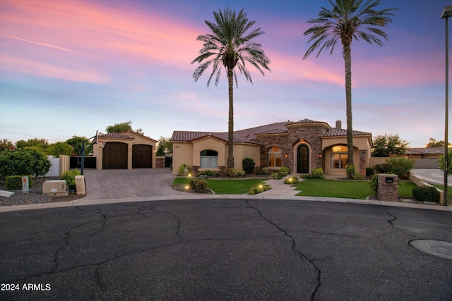 8325 W Cantera Ave, Peoria, AZ 85383 - mediterranean / spanish home featuring driveway, a tile roof, stucco siding, and a garage