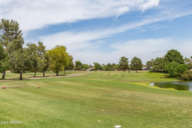 view of home's community featuring a yard and a water view