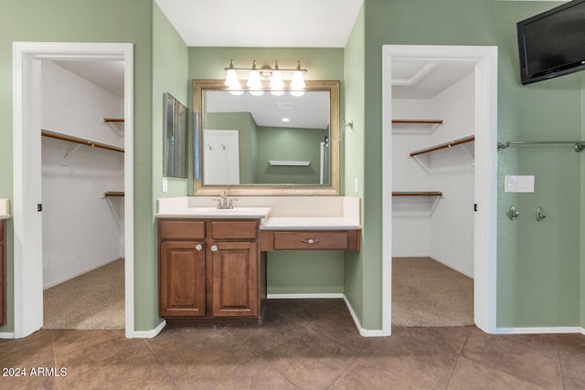 bathroom with tile patterned flooring and vanity